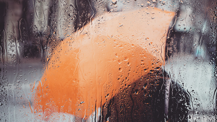 Rainy weather and raindrops on the glass. A window with raindrops.