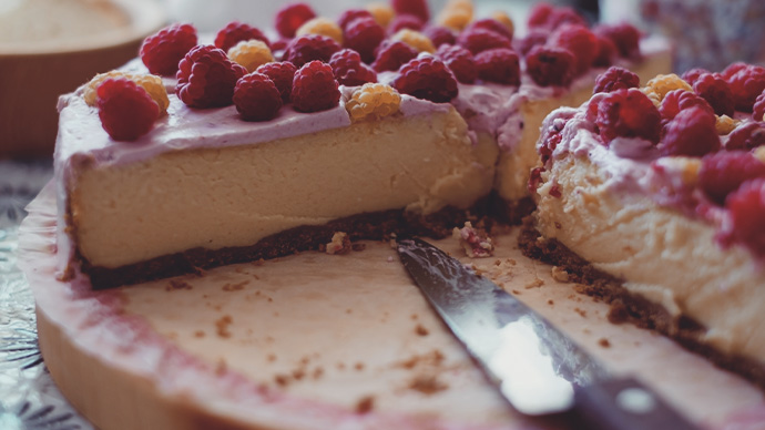 Handmade raspberry cheesecake with pink cream. Cooking at home