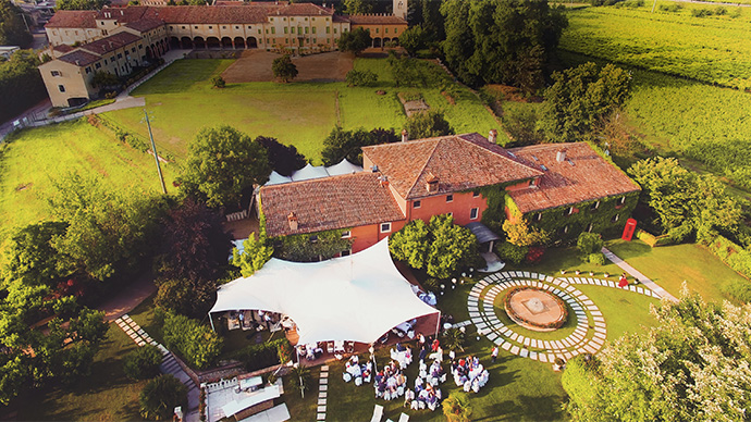 Verona, Italy - June 12, 2016: Aerial view of an old country house in the vineyards.